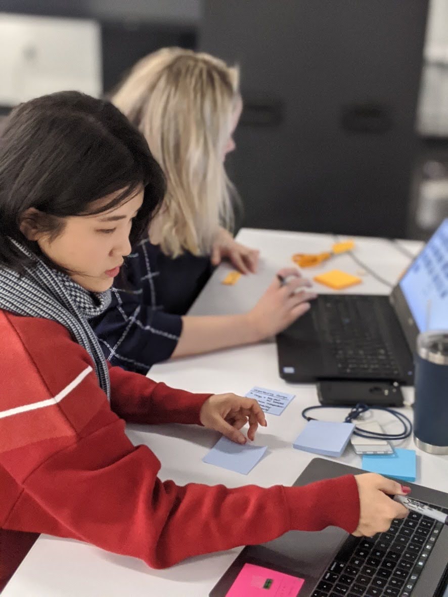 Workshop preparation — designer working on customer research synthesis