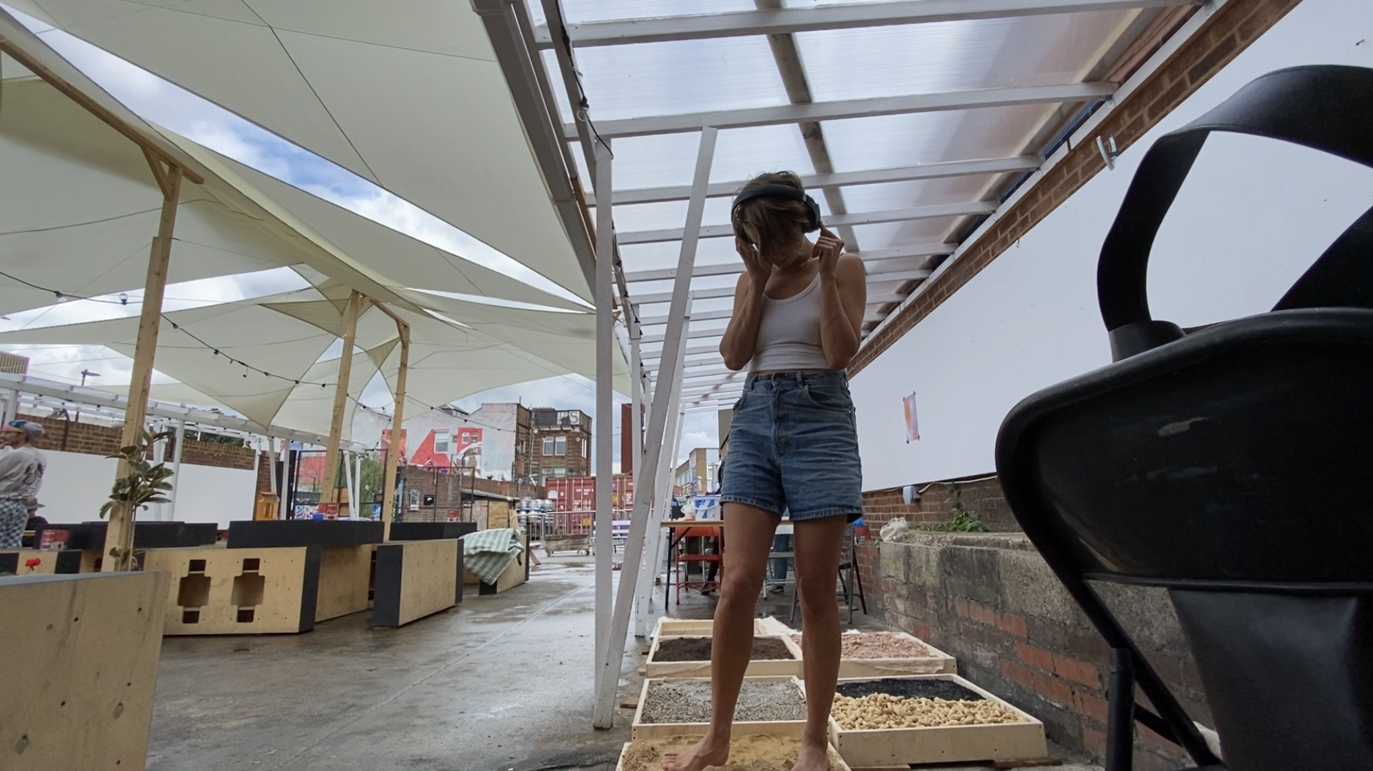 Visitor experiencing the sensory platform with headphones